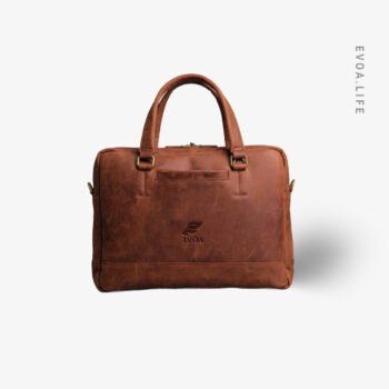 Built for serious workdays, this full-grain leather laptop bags combines clean design with lasting durability. The structured body protects your laptop while aging beautifully over time. A padded main compartment, space for daily essentials, sturdy top handles, and a detachable shoulder strap offer comfort, flexibility, and a confident professional presence wherever work takes you.