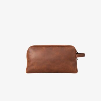 Handcrafted from full-grain leather, the Pouch Bag is a minimal, secure home for your phone, wallet, and keys. Its adjustable strap allows for flexible waist or chest wear, while the premium leather develops a unique patina over time. Every stitch and zipper is designed for durability and ease, moving with you without adding bulk.