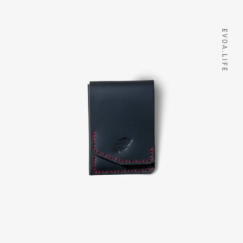 Bold style meets ultra-secure utility. Our Handmade Vertical Snap Wallet pairs rich Deep Ocean Blue Color leather with a striking crimson red hand-stitch in a sleek, non-bulky design.